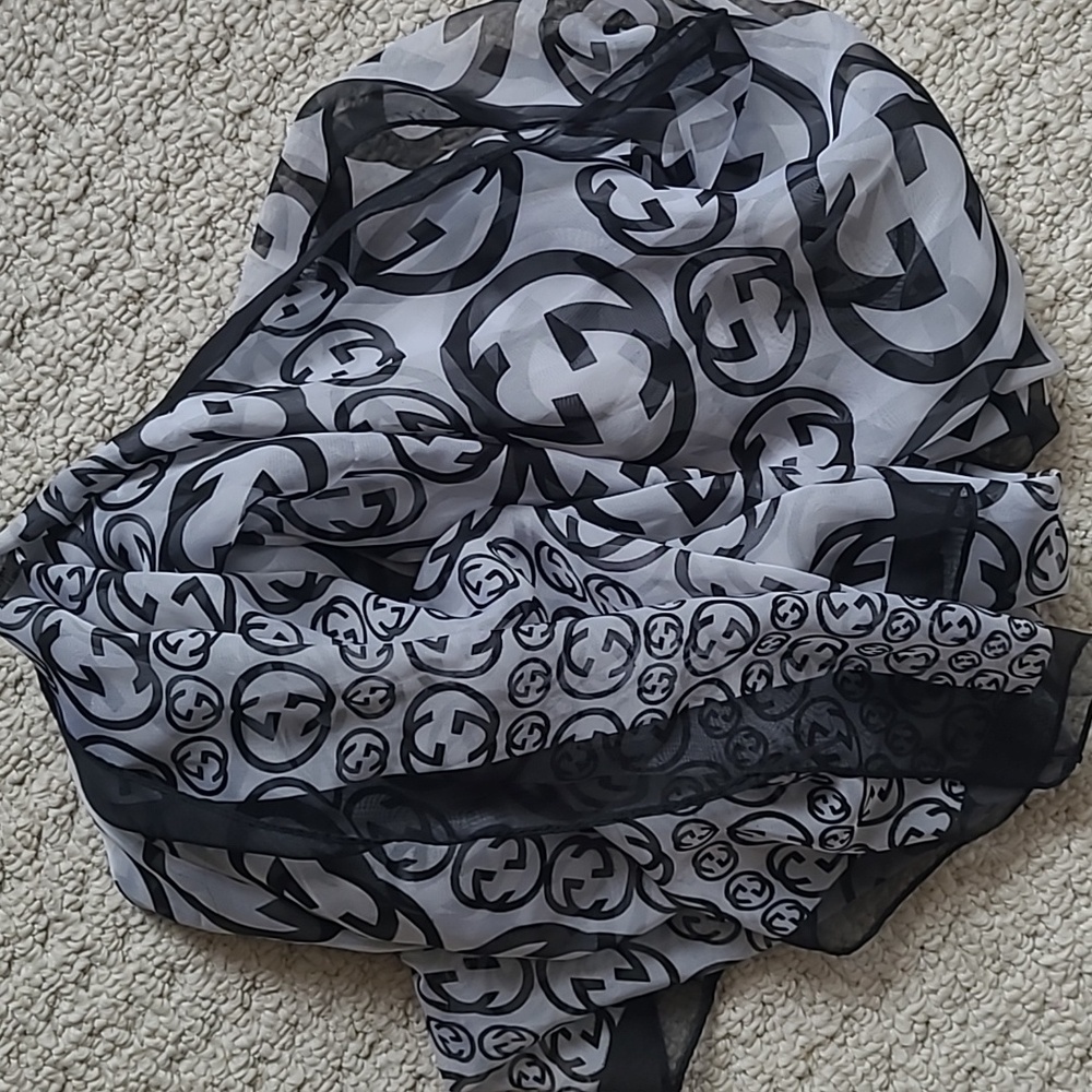 Not Gucci Black and Grey Pattern Scarf
68“ x 26“
Very generous and lux feel.